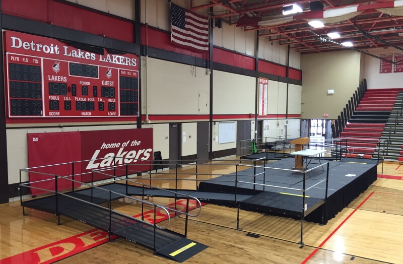 The Detroit Lakes High School in Detroit Lakes, MN has a wheelchair ramp for their commencement ceremony thanks to the Amramp Minnesota team.
