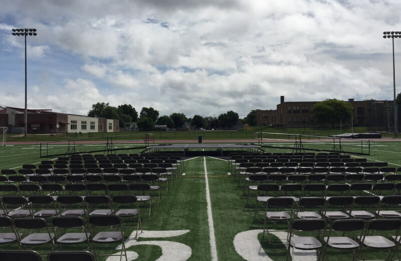 This outdoor graduation at Winona High School is outfitted with wheelchair ramps from Amramp Minnesota.