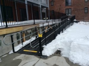 This is one of several wheelchair ramps installed by the Amramp Boston team to provide access for The Distillery, a vibrant community of artists, artisans and small businesses located in a beautiful mid-19th century converted rum distillery in South Boston, Massachusetts. The ramps provide access for the artists and visitors to the art galleries and businesses in the building.