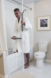 SuperPole with SuperBar handle provides stability in bathroom.